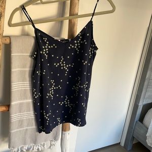 Equipment Navy blue blouse 100% silk; adjustable straps.